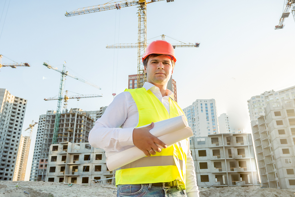 construction-inspector-posing-with-blueprints-on-b-2026-01-06-10-59-01-utc 2 (2)